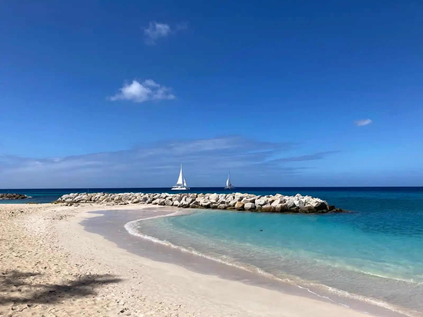 Heywoods Beach jetty with sailboats, Barbados