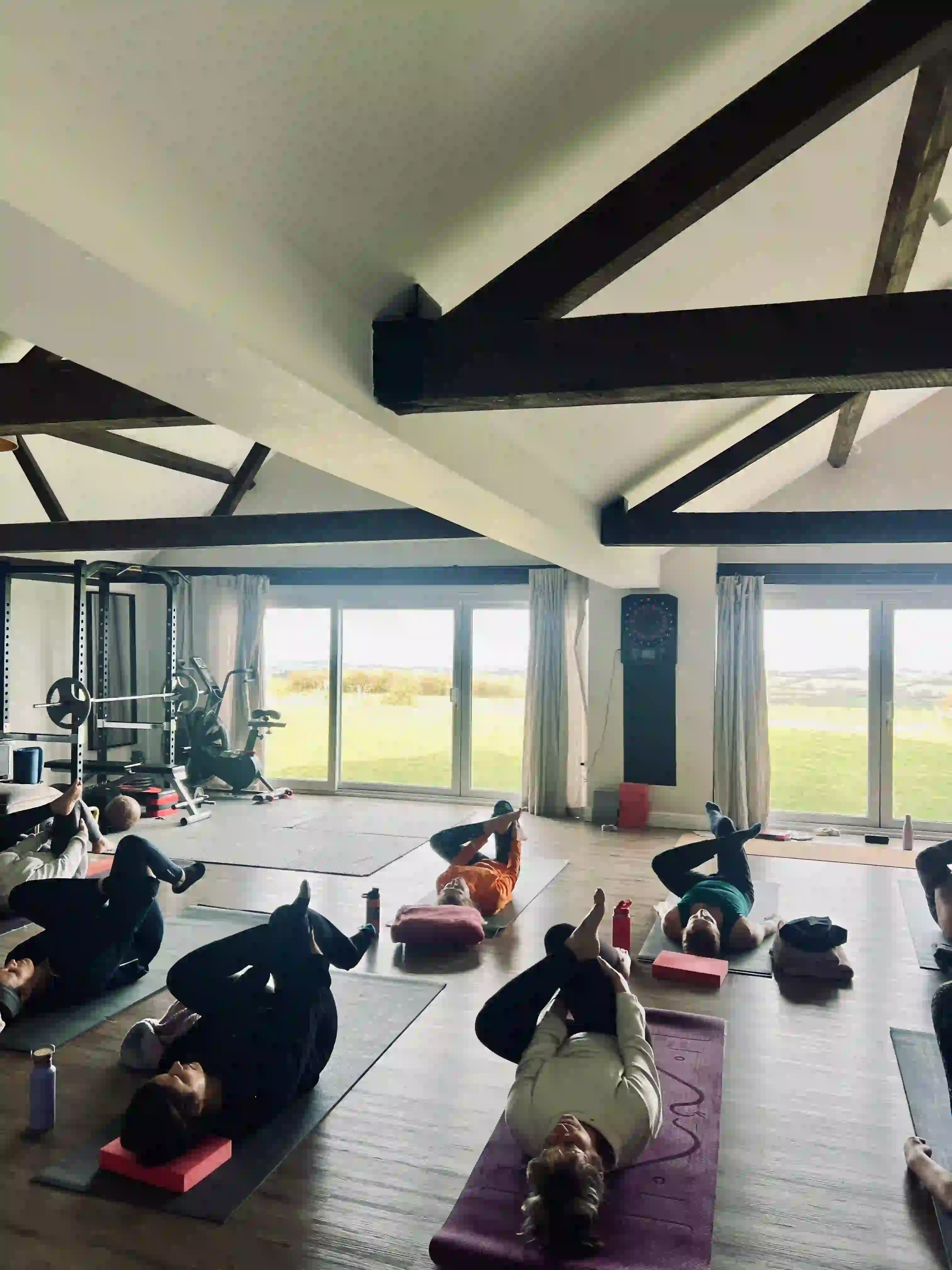 Grounding yoga session in a rustic Cotswolds barn