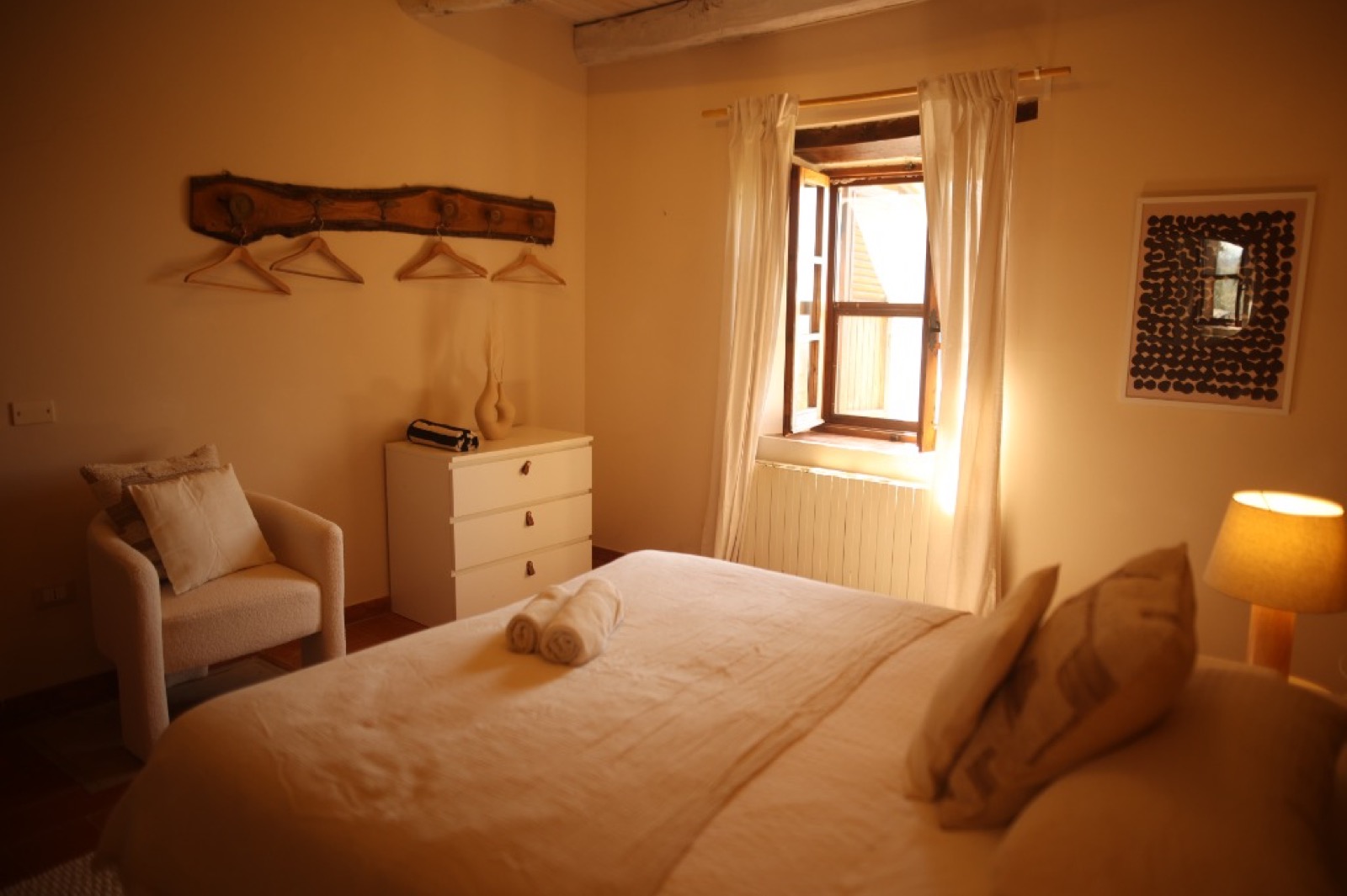 Elegant single occupancy bedroom with Italian countryside views